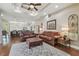Cozy living room featuring hardwood floors, a decorative rug, and ample seating at 2712 Clubhouse Dr, Plant City, FL 33566