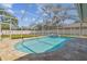 Relaxing screened-in pool with stone patio and spa, perfect for outdoor entertaining at 2712 Clubhouse Dr, Plant City, FL 33566
