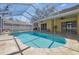 Wonderful pool and spa featuring a screened enclosure and tile flooring for seamless indoor-outdoor living at 2712 Clubhouse Dr, Plant City, FL 33566