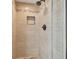 Modern shower with stylish tilework, a built-in niche, and bronze hardware at 2712 Clubhouse Dr, Plant City, FL 33566
