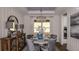 Elegant dining room featuring a stylish chandelier, round table, and sophisticated decor at 29837 Imperati Blvd, Wesley Chapel, FL 33543