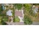 Overhead aerial shot showcases the house's roof, driveway, and surrounding trees at 3119 W North St, Tampa, FL 33614