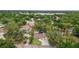 Aerial view of home with mature trees and landscaping in a lush, green neighborhood at 3119 W North St, Tampa, FL 33614