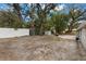 Expansive backyard with mature trees, offering a tranquil outdoor space for relaxation at 3119 W North St, Tampa, FL 33614