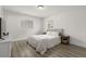 Bright bedroom with wood floors, natural light, and neutral decor at 3119 W North St, Tampa, FL 33614