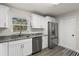 Bright kitchen features stainless steel appliances, granite countertops and ample cabinet space at 3119 W North St, Tampa, FL 33614