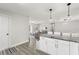 Open floor plan with kitchen island and view into the living room, great for entertaining at 3119 W North St, Tampa, FL 33614