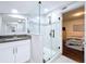 Modern bathroom featuring a glass-enclosed shower, granite countertops, and a stylish vanity at 3213 E Genesee St, Tampa, FL 33610