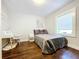 Comfortable bedroom featuring a desk, a window, and a clean design at 3213 E Genesee St, Tampa, FL 33610