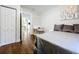 Stylized bedroom with a desk and hardwood flooring at 3213 E Genesee St, Tampa, FL 33610