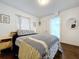 Inviting bedroom with hardwood floors, a comfortable bed, and calming decor at 3213 E Genesee St, Tampa, FL 33610