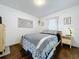 Bright bedroom with a comfortable bed, dresser, and natural light at 3213 E Genesee St, Tampa, FL 33610