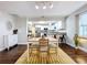 Bright dining room with wood table, chairs, and an open view to the kitchen, perfect for entertaining at 3213 E Genesee St, Tampa, FL 33610