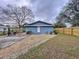 Charming single story home with a minimalist front yard and a fenced in backyard at 3213 E Genesee St, Tampa, FL 33610
