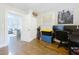 Well-lit office space with hardwood floors, ample storage, and a view to the living room at 3213 E Genesee St, Tampa, FL 33610