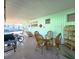 Covered carport providing a comfortable outdoor area with seating, dining, and additional storage space at 34483 Cactus N Dr, Pinellas Park, FL 33781