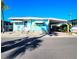 Charming, well-maintained mobile home featuring a covered carport and tasteful decor, perfect for coastal living at 34483 Cactus N Dr, Pinellas Park, FL 33781