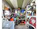 Storage room with shelving containing a variety of tools, hardware, and cleaning supplies at 34483 Cactus N Dr, Pinellas Park, FL 33781