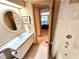 Bathroom boasts a vanity, sink, and a mirror along with a shower at 36750 Us 19 N Hwy # 3104, Palm Harbor, FL 34684