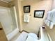 Bathroom has a shower-tub combo, toilet, vanity, and framed artwork at 36750 Us 19 N Hwy # 3104, Palm Harbor, FL 34684