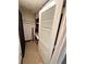 An open closet with a white shutter door, with storage shelves and clothes rod visible at 36750 Us 19 N Hwy # 3104, Palm Harbor, FL 34684