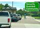 Security guarded community entrance with cars lined up at the gate at 36750 Us 19 N Hwy # 3104, Palm Harbor, FL 34684