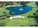 Scenic golf course view featuring a water hazard with fountain and well-maintained greens and sand traps at 36750 Us 19 N Hwy # 3104, Palm Harbor, FL 34684
