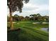 Picturesque golf course with mature trees, undulating greens, and strategically placed sand bunkers at 36750 Us 19 N Hwy # 3104, Palm Harbor, FL 34684