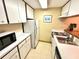Efficient kitchen layout with ample cabinet space and modern appliances at 36750 Us 19 N Hwy # 3104, Palm Harbor, FL 34684