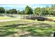 Picturesque stone bridge over a serene pond in the community's green landscape at 36750 Us 19 N Hwy # 3104, Palm Harbor, FL 34684