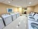 On-site laundry room with multiple washers and dryers at 36750 Us 19 N Hwy # 3104, Palm Harbor, FL 34684