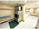 On-site laundry room featuring an ice maker, and multiple washing machines at 36750 Us 19 N Hwy # 3104, Palm Harbor, FL 34684