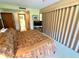 Bedroom with a comfortable bed, TV, and an en-suite bathroom at 36750 Us 19 N Hwy # 3104, Palm Harbor, FL 34684