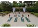 Outdoor yoga deck with group class in progress; beautiful landscaping and serene setting at 36750 Us 19 N Hwy # 3104, Palm Harbor, FL 34684