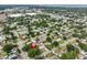 Aerial view of a property surrounded by mature trees with a red pin indicating the location of the property at 3915 W Leila Ave, Tampa, FL 33616