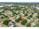 Overhead view of a property located in a residential area with a nearby swimming pool and street access at 3915 W Leila Ave, Tampa, FL 33616