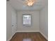 Clean bedroom featuring hardwood floors, a ceiling fan, and a window at 3915 W Leila Ave, Tampa, FL 33616