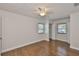 Spacious bedroom with hardwood floors, neutral walls, and a ceiling fan at 3915 W Leila Ave, Tampa, FL 33616