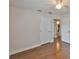 Bedroom with hardwood flooring, white doors and trim, and neutral wall paint at 3915 W Leila Ave, Tampa, FL 33616