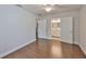 Bedroom featuring hardwood floors and an ensuite bathroom with double doors at 3915 W Leila Ave, Tampa, FL 33616