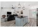 Open concept living space, flowing from kitchen with island to living room, offering seamless living at 40627 Jerry Rd, Zephyrhills, FL 33540