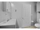Well-lit bathroom showcasing a gray vanity, neutral walls, and modern fixtures at 4222 Trumpworth Ct, Valrico, FL 33596