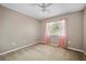Neutral bedroom with carpet, a window with light pink curtains, and lots of light at 4222 Trumpworth Ct, Valrico, FL 33596