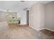 Large bedroom with carpet, ceiling fan, a double door closet and a view of the backyard at 4222 Trumpworth Ct, Valrico, FL 33596