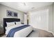Bedroom with neutral walls, a large bed, and a spacious closet at 4222 Trumpworth Ct, Valrico, FL 33596