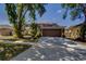 Home with an attached two-car garage and driveway at 4222 Trumpworth Ct, Valrico, FL 33596