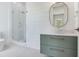 Modern bathroom featuring glass enclosed shower, floating vanity with vessel sink, and shiplap accent wall at 509 Buckingham E Ave, Oldsmar, FL 34677