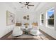 Spacious primary bedroom with tray ceiling, neutral paint, hardwood floors, and lots of natural light at 509 Buckingham E Ave, Oldsmar, FL 34677