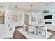 Spacious open-concept kitchen, dining, and living area with cohesive design elements and ample natural light, ideal for modern living at 509 Buckingham E Ave, Oldsmar, FL 34677
