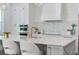 Modern kitchen featuring quartz countertops, a stylish backsplash, and high-end stainless appliances at 509 Buckingham E Ave, Oldsmar, FL 34677